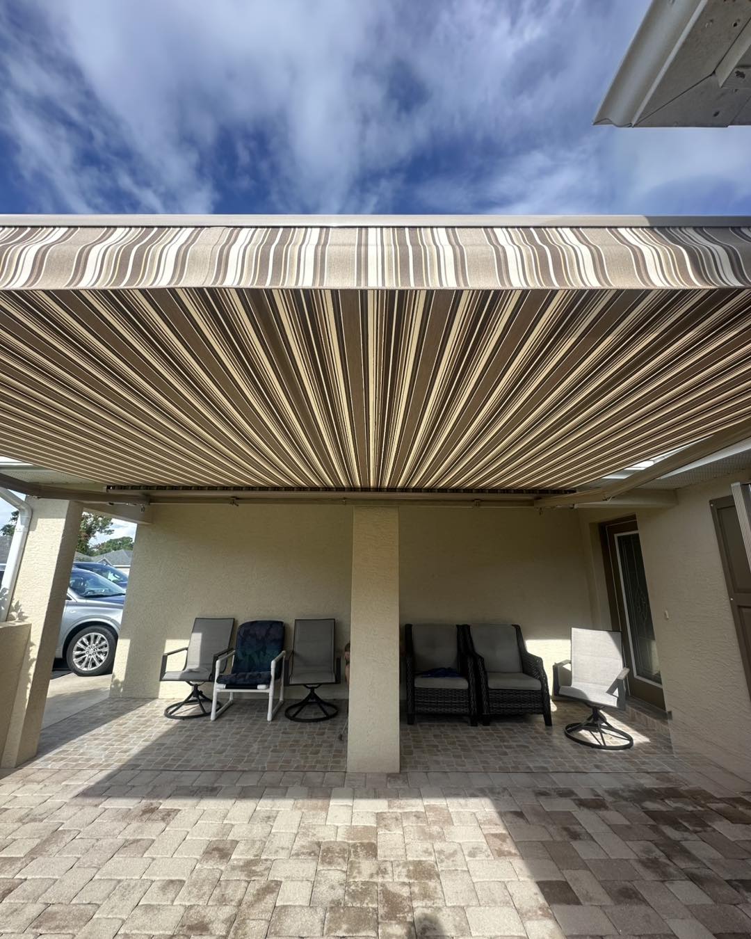 539992948_122137698824803686_5368811284492139847_n Before and after garage transformation with Urban Shadeworks motorized retractable screen in Lakeland, FL
