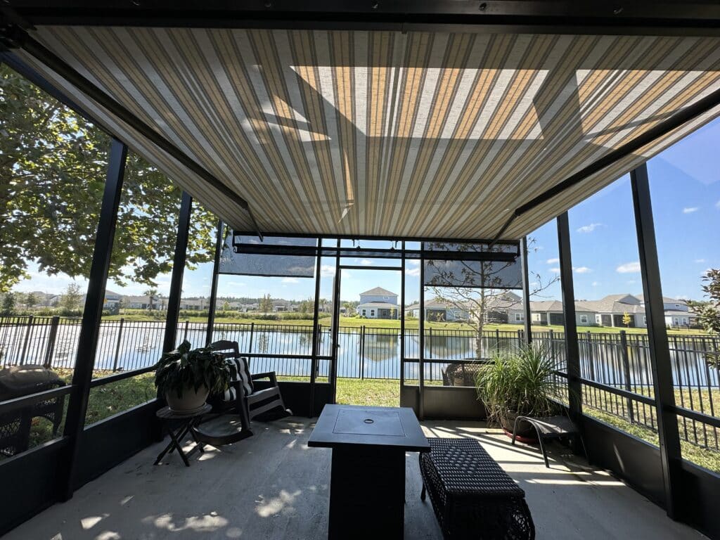 Outdoor kitchen protected by motorized retractable awning in Polk County Florida