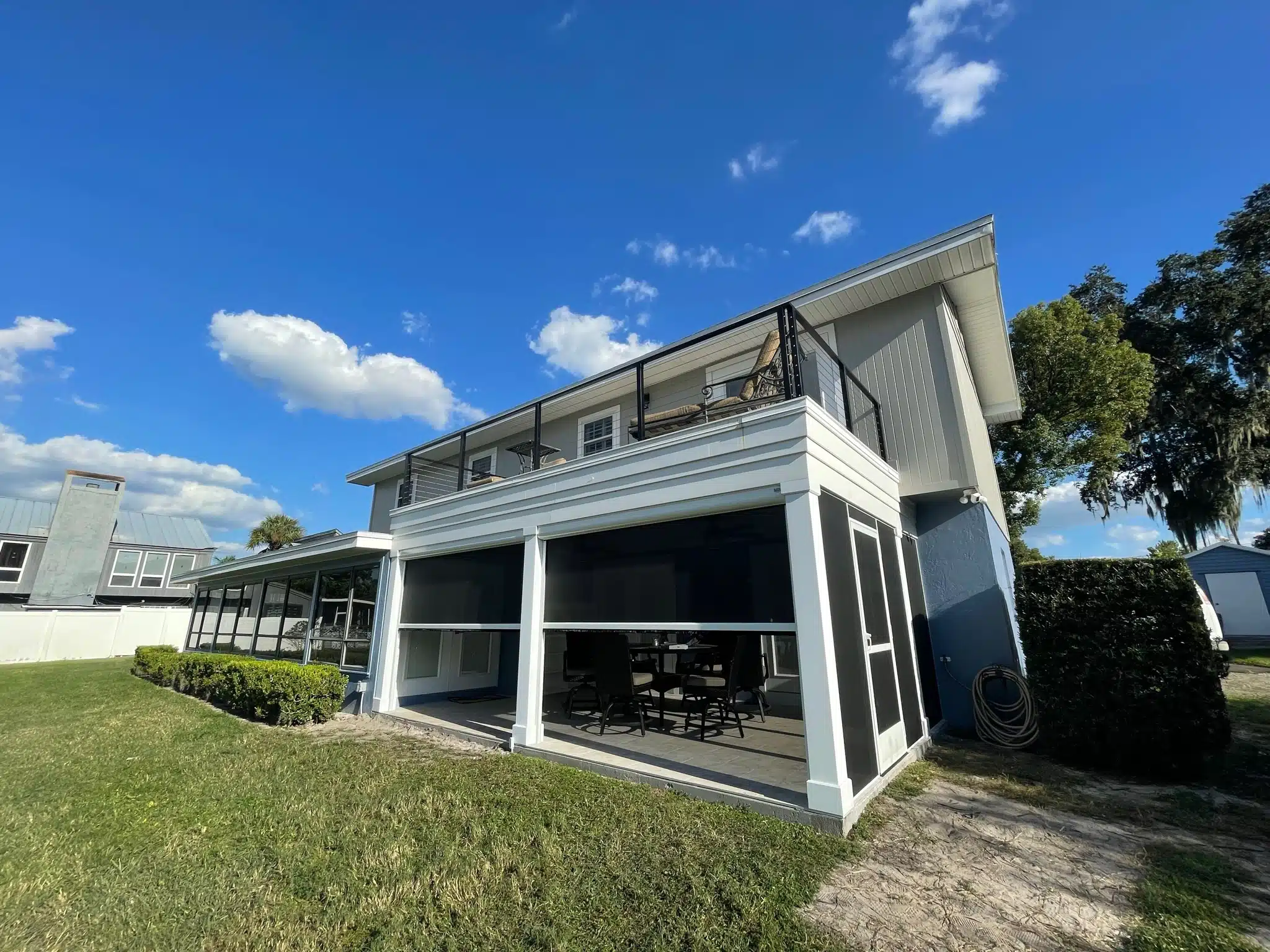 Beautiful transformed lanai with Urban Shadeworks motorized retractable screens in Winter Haven, FL